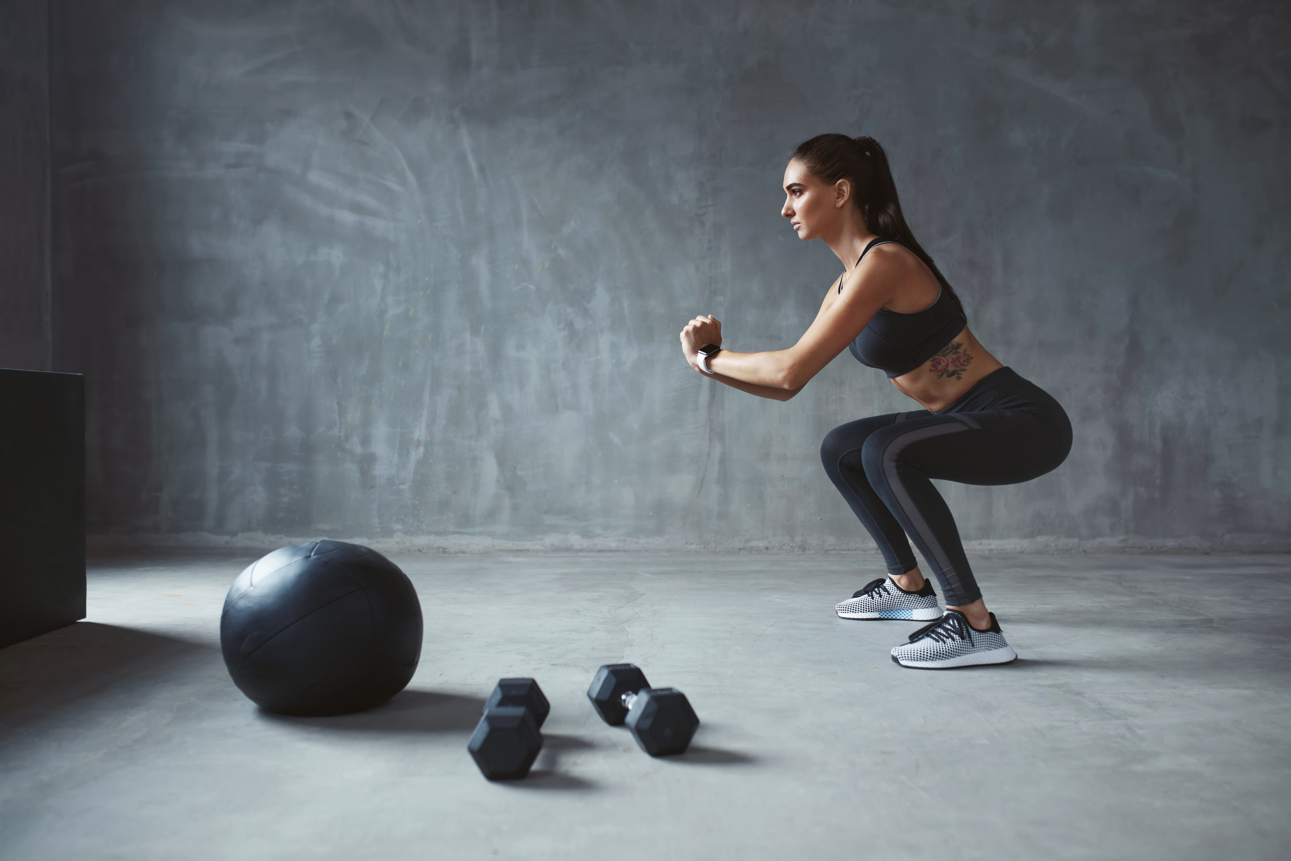 Body Workout. Fitness Woman In Stylish Sports Clothes Exercising