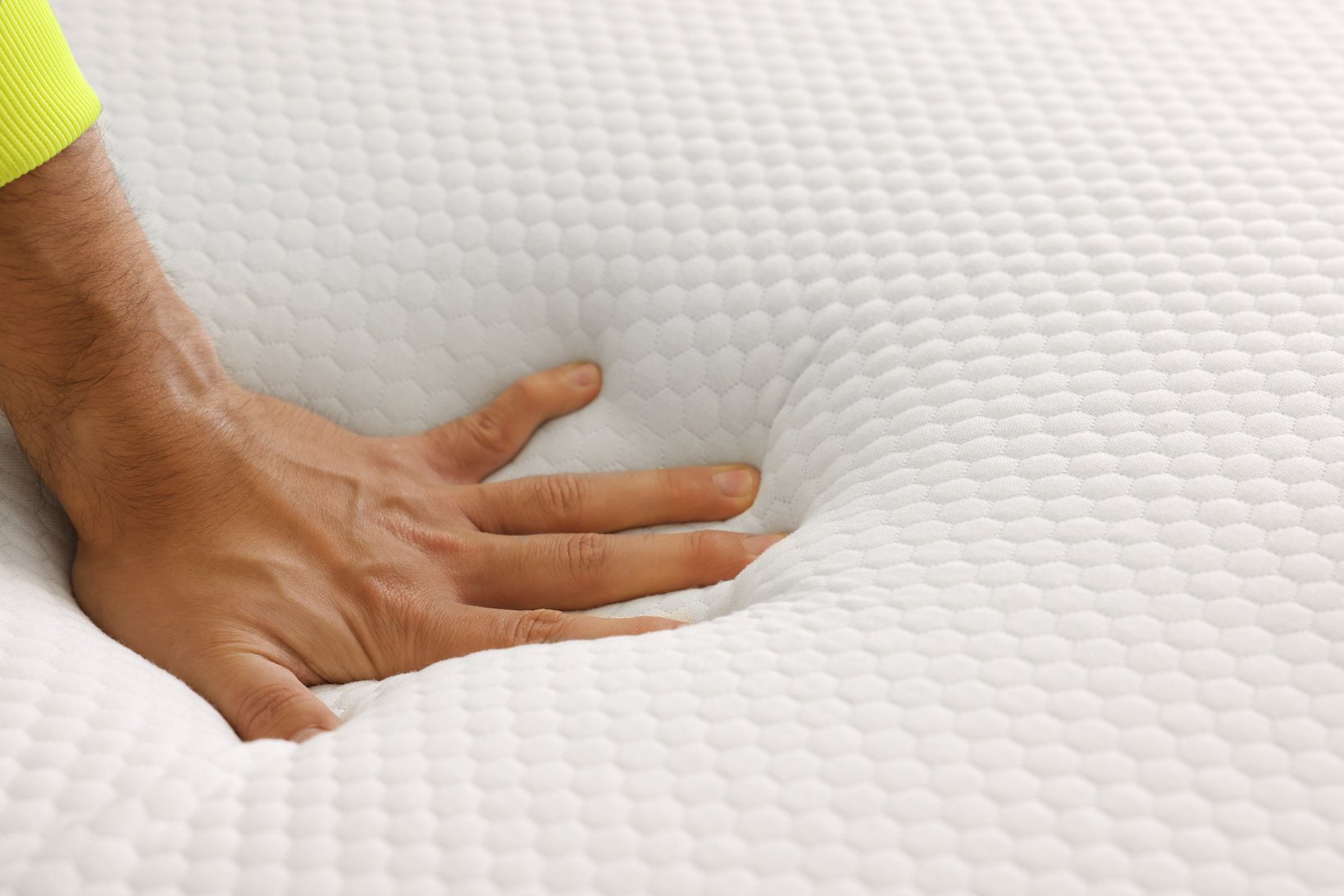 Man Touching Soft White Memory Foam Mattress Topper, Closeup. Sp